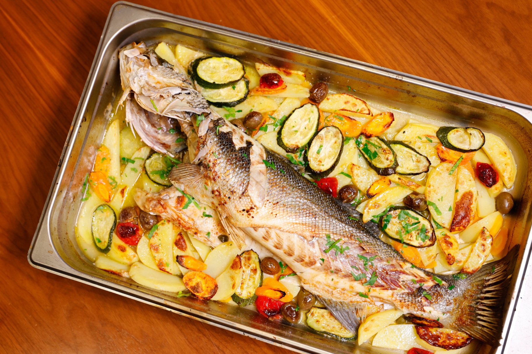 Whole roasted branzino with vegetables